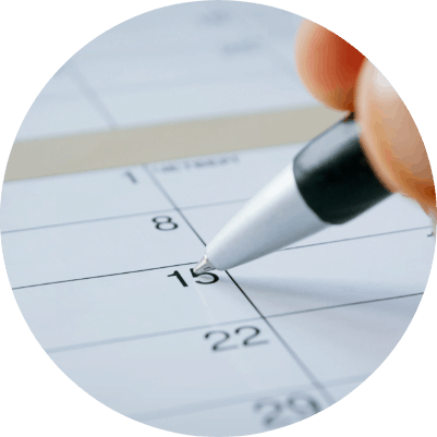 person-writing-calendar-date-15th